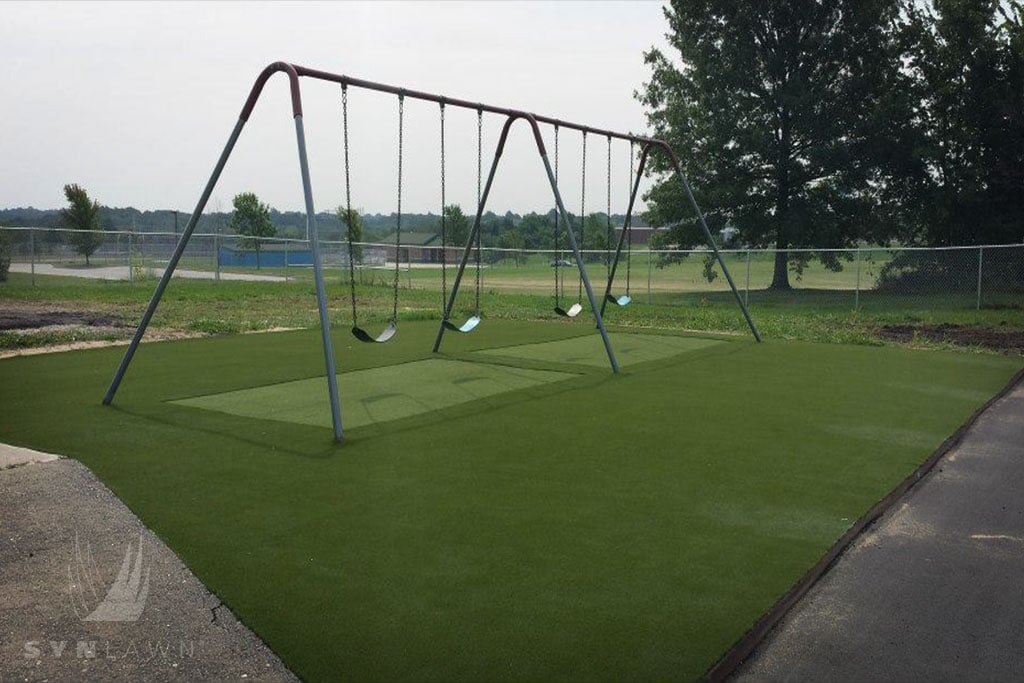 image of synthetic installed under swing set at william yates elementary