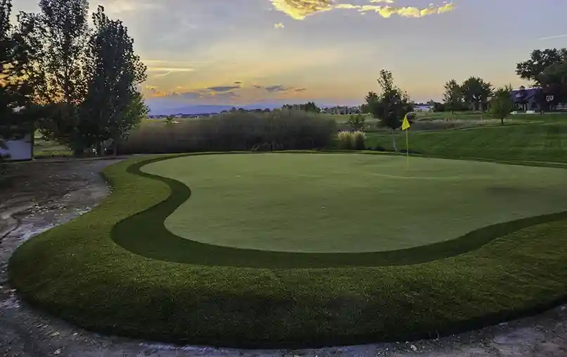 image of a SYNLawn artificial turf putting green during the sunset