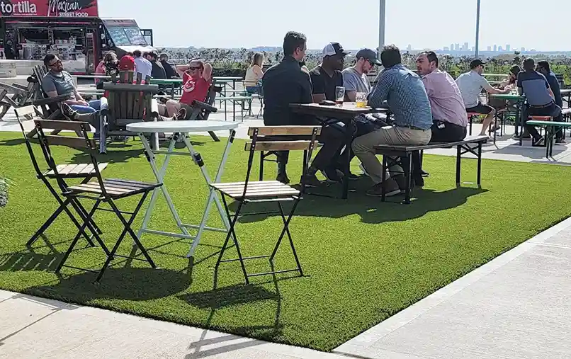 image of people enjoying a nice day on SYNLawn artificial turf