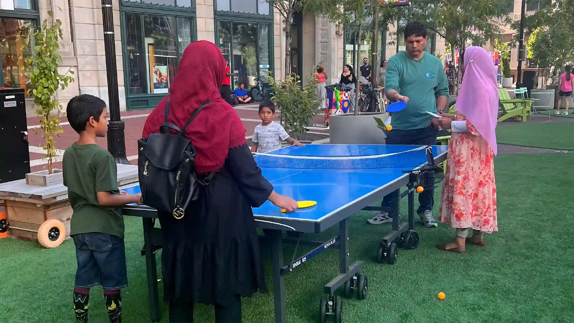 image of people playing ping pong on SYNLawn artificial grass at historic Monument Circle Park Indianapolis Indiana
