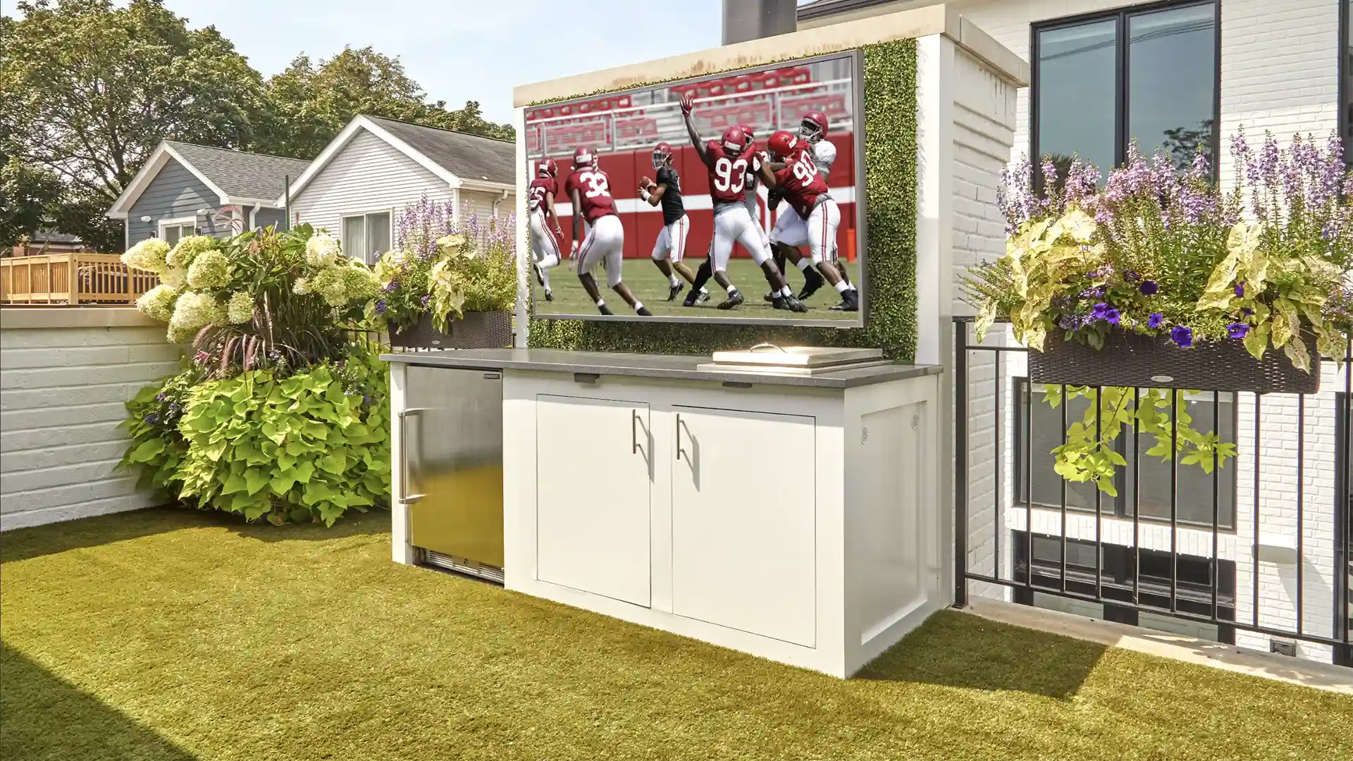 image of Sports themed rooftop installation of SYNLawn artificial grass with Calico Greens faux living wall panels at Roscoe Village neighborhood home in Chicago Illinois