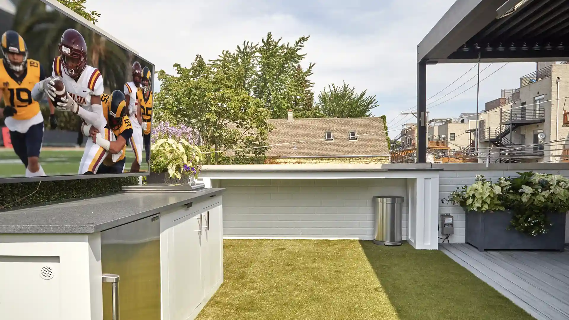 image of Sports themed rooftop installation of SYNLawn artificial grass with Calico Greens faux living wall panels at Roscoe Village neighborhood home in Chicago Illinois