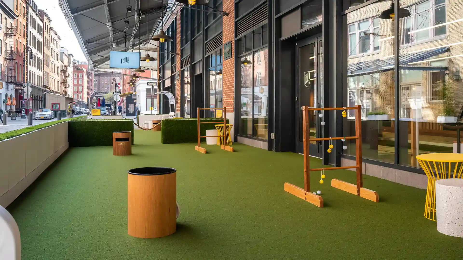 SYNLawn artificial grass at The Lawn Club NYC indoor entertainment complex with outdoor lawn games located in the Seaport District of New York City
